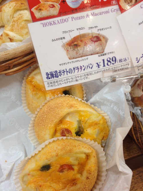 Italian dressing, Macaroni, Potato gratin, and a tomato on "fluffy" bread